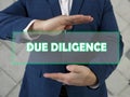 DUE DILIGENCE text in futuristic screen. Due diligenceÃÂ is an investigation, audit, or review performed to confirm facts or